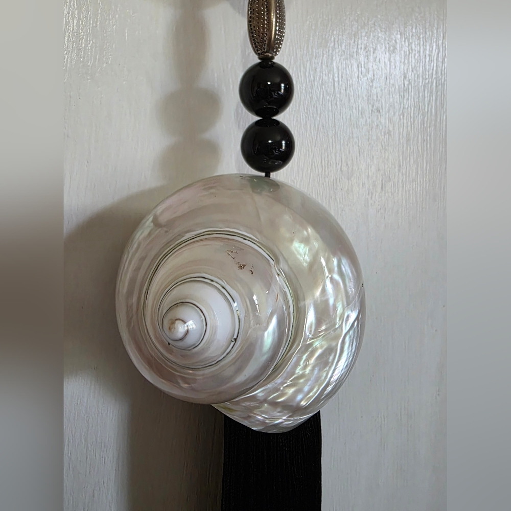 Shell With Black Tassel